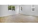 Unfurnished bedroom with wood-look tile and natural light streaming through multiple windows at 3725 Deer Ridge Dr, Mount Dora, FL 32757