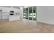 Sun-filled living area adjacent to the kitchen features expansive sliding glass doors to the backyard at 3725 Deer Ridge Dr, Mount Dora, FL 32757