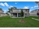 The backyard is large and grassy and features a small tree at 3741 Deer Ridge Dr, Mount Dora, FL 32757