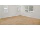 Bright, empty bedroom featuring tile flooring and multiple windows for natural light at 3741 Deer Ridge Dr, Mount Dora, FL 32757