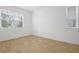 Bright, empty bedroom featuring tile flooring, large windows, and neutral paint at 3741 Deer Ridge Dr, Mount Dora, FL 32757