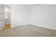 Neutral carpeted bedroom features a closet and leads to an ensuite bathroom at 3741 Deer Ridge Dr, Mount Dora, FL 32757