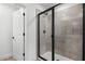 Stylish bathroom shower with gray tiled walls and glass enclosure at 3749 Deer Ridge Dr, Mount Dora, FL 32757