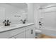 Modern bathroom features double vanity, white cabinets, and sleek fixtures at 3749 Deer Ridge Dr, Mount Dora, FL 32757