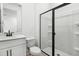 Modern bathroom featuring a glass-enclosed shower, sleek vanity, and contemporary fixtures at 3749 Deer Ridge Dr, Mount Dora, FL 32757