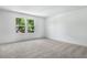 Spacious carpeted bedroom with two large windows offering a bright, airy feel at 3749 Deer Ridge Dr, Mount Dora, FL 32757