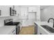 Stylish kitchen with white cabinets, stainless steel appliances, and white subway tile backsplash at 3749 Deer Ridge Dr, Mount Dora, FL 32757
