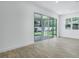 Open living area with sliding glass doors to the patio and a view of the backyard at 3749 Deer Ridge Dr, Mount Dora, FL 32757