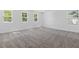 Neutral bedroom features soft carpeting and large windows offering plenty of natural light at 3757 Deer Ridge Dr, Mount Dora, FL 32757
