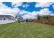 Large, well-maintained backyard with a firepit, shed, and privacy fence, perfect for outdoor activities and relaxation at 4217 Park Lake St, Orlando, FL 32803