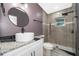 Modern bathroom featuring a stylish vanity, granite countertops, contemporary fixtures, and a tiled walk-in shower at 4217 Park Lake St, Orlando, FL 32803