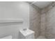 Compact bathroom featuring a stand-up shower with marble-style tiles and a modern vanity at 4217 Park Lake St, Orlando, FL 32803