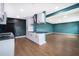 Modern kitchen with white cabinets, sleek countertops, stainless steel appliances, and a large island at 4217 Park Lake St, Orlando, FL 32803