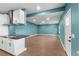 Open living room with light blue walls, modern cabinets, and wood-style flooring at 4217 Park Lake St, Orlando, FL 32803