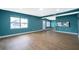 Open living space with hardwood floors, ample natural light, and a view of the adjacent kitchen area at 4217 Park Lake St, Orlando, FL 32803
