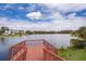 Picturesque waterfront with a wooden dock extending over the serene lake, offering stunning views and recreation at 4217 Park Lake St, Orlando, FL 32803