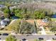 Aerial view of the home set amongst mature trees and landscaping in a Gathering neighborhood at 4222 Gold Rush Ln, St Cloud, FL 34772