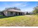 Well-maintained lawn behind the house, offering a large outdoor play or relaxation area at 4222 Gold Rush Ln, St Cloud, FL 34772