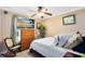 Comfortable bedroom with calming decor, a dresser, and a ceiling fan at 4222 Gold Rush Ln, St Cloud, FL 34772