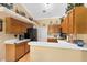 Kitchen showcasing a breakfast bar with a view into the dining area and wood laminate flooring at 4222 Gold Rush Ln, St Cloud, FL 34772