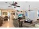 Open living area with vaulted ceilings, ceiling fans and view of kitchen and dining area at 4222 Gold Rush Ln, St Cloud, FL 34772