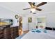 Spacious bedroom with ensuite bathroom access, featuring a TV and a large dresser at 4222 Gold Rush Ln, St Cloud, FL 34772