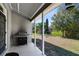 View of an outdoor grill and a spacious patio overlooking the backyard at 4222 Gold Rush Ln, St Cloud, FL 34772