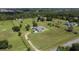Aerial view of a beautiful home surrounded by lush landscaping and mature trees at 4261 Twilight Trl, Kissimmee, FL 34746