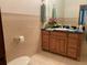 Charming bathroom with a custom vanity, decorative tile work, and a coordinated color scheme at 4261 Twilight Trl, Kissimmee, FL 34746