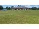 A well-kept home with a lush front lawn providing a serene and welcoming atmosphere at 4261 Twilight Trl, Kissimmee, FL 34746