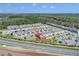 Aerial view of home and community with proximity to highway at 4544 Teoli Ct, Kissimmee, FL 34746