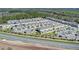 Overhead shot of a vibrant neighborhood highlighting modern townhomes, landscaped grounds, and a community-friendly layout at 4544 Teoli Ct, Kissimmee, FL 34746
