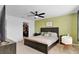 Bedroom with closet, bed, and green accent wall at 4544 Teoli Ct, Kissimmee, FL 34746