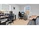 Bedroom with two work areas, gaming chair and sofa at 4544 Teoli Ct, Kissimmee, FL 34746