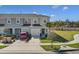Inviting townhome boasting a private garage, and a manicured front yard showcasing attractive landscaping and curb appeal at 4544 Teoli Ct, Kissimmee, FL 34746
