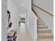 Inviting hallway with view to back yard and access to staircase at 4544 Teoli Ct, Kissimmee, FL 34746