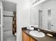 Neutral bathroom featuring a tub/shower, a vanity with counter space, and a large mirror at 509 Cadiz Loop, Davenport, FL 33837