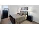 Bright bedroom featuring comfortable bedding, a window, and tasteful decor at 509 Cadiz Loop, Davenport, FL 33837