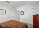Cozy bedroom features a comfortable bed, TV, closet, and ensuite bathroom at 509 Cadiz Loop, Davenport, FL 33837
