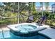 Screened-in hot tub and lounge area for relaxation and enjoyment at 509 Cadiz Loop, Davenport, FL 33837