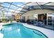 Inviting screened-in pool and patio offer a serene outdoor space at 509 Cadiz Loop, Davenport, FL 33837