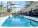 Relaxing screened-in pool and jacuzzi for outdoor enjoyment at 509 Cadiz Loop, Davenport, FL 33837