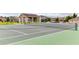 A well-maintained community tennis court, surrounded by lush greenery, offers an active lifestyle at 509 Cadiz Loop, Davenport, FL 33837