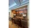 A convenient bar area featuring granite countertops, stylish lamps, and comfortable seating at 5160 Conroy Rd # 1414, Orlando, FL 32811