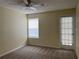 Bright bedroom featuring neutral carpet, window and door to let in natural light at 5160 Conroy Rd # 1414, Orlando, FL 32811