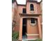 Three-story mediterranean style building with orange stucco and interesting architectural details at 5160 Conroy Rd # 1414, Orlando, FL 32811