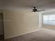 Spacious carpeted living room with ceiling fan, and natural light from windows at 5160 Conroy Rd # 1414, Orlando, FL 32811