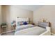 Cozy bedroom featuring a comfortable bed, neutral decor and a well-organized dresser at 5457 Animosh Ct, Polk City, FL 33868