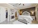 This bedroom offers a modern accent wall, a bed with decorative pillows and a fireplace at 5457 Animosh Ct, Polk City, FL 33868