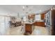 Open-concept kitchen with a dining area that seamlessly connects to the living room and outdoor spaces at 5457 Animosh Ct, Polk City, FL 33868